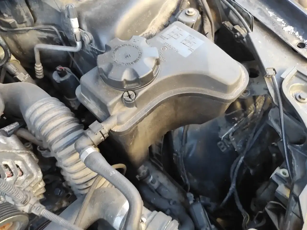 Où mettre le liquide de refroidissement dans une BMW Série 1 ?
